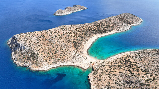 Aerial drone photo of paradise secluded beach of Feidoussa in small isled of Ofeidousa only accessible by boat next to Schoinousa island, Small Cyclades, Greece