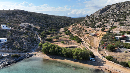 Aerial drone photo of small port of Schoinousa island a safe harbour to yachts and sail boats featuring small beach of Myrsini covered in Almirikia trees, Small Cyclades, Greece