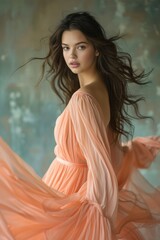 Obraz premium a woman elegantly adorned in a flowing peach - colored long dress