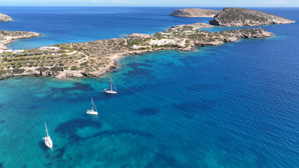 Aerial drone photo of beautiful seascape in island of Shoinousa untouched. by tourism, Small Cyclades, Greece