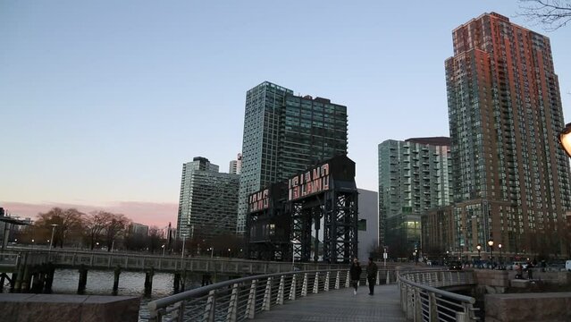 Long Island City sign with tall residential high rise buildings in the background.
