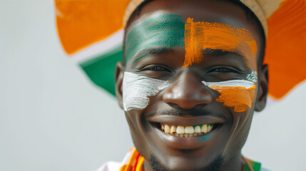 Niger flag face paint, Close-up of a person's face, symbolizing patriotism or sports fandom.