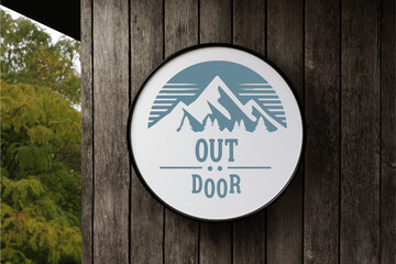 Blue Mountain with Outdoor Text in Circle White Signboard on the empty Wood Wall