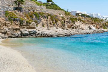 Psarou beach in Mykonos, Greece, umbrella and luxury beach services. Psarou beach is the favorite...