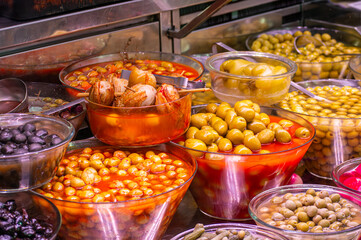 Buying olives in central market in Valencia, Spain
