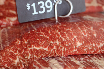 Close up of Australian beef displayed at a butcher shop. Wagyu flank
