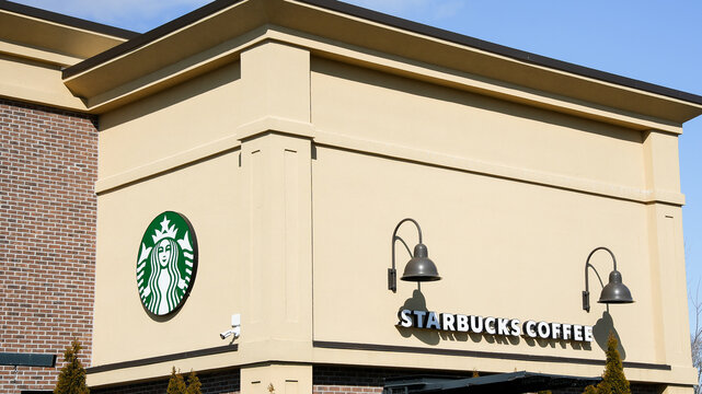 NORWALK, CT, USA - FEBRUARY 9, 2024:   Starbucks coffee building near Post road in Norwalk in nice sunny winter day