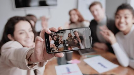 Close up business people different race free time excited team building hug embrace cuddle she her he him his smart phone make take selfies