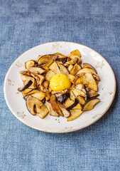 Sliced Porcini mushrooms (Boletus Edulis) with egg yolk. - 732027338