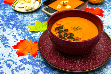 Diet pumpkin soup in a brown bowl