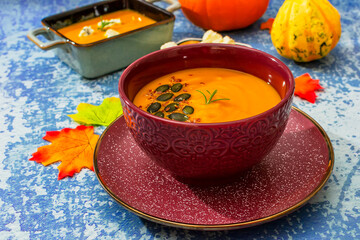 Diet pumpkin soup in a brown bowl