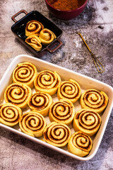 Ceramic plate with raw cinnamon rolls