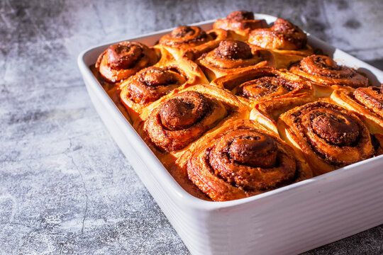 Ceramic plate with freshly baked cinnamon rolls