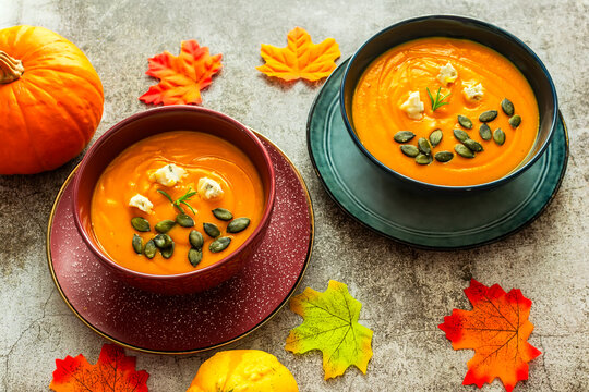 Diet pumpkin soup in a blue bowl