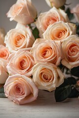 Beautiful bouquet of roses on white wooden table, closeup