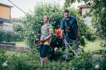 Two men are working in the garden.