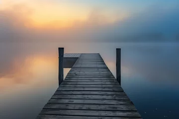 Fotobehang pier at dawn with lake mist © Sardar