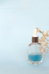 Cosmetic beauty product on blue background. Beauty product concept. Front view. Spring Mockup.