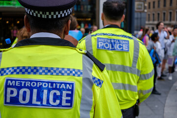 Police officers patrolling during event in London , metropolitan police - obrazy, fototapety, plakaty