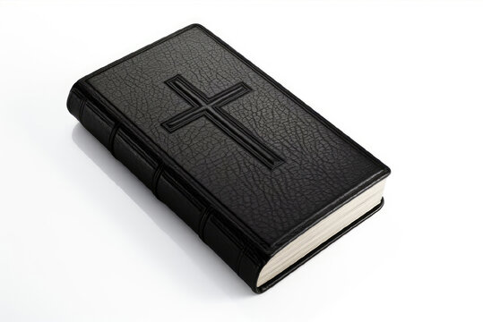 Black Bible on the white background. hardcover, cross on the cover.