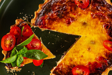 Obraz na płótnie Canvas cheese and cherry tomato quiche