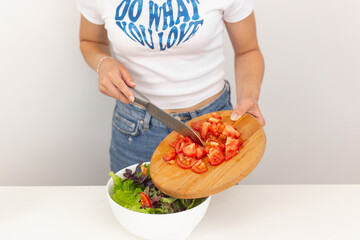 person holding a basket full of vegetables