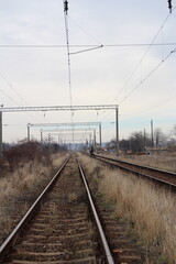 Fototapeta na wymiar Train tracks with a train on the side