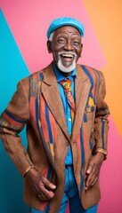 Fototapeta premium Cool senior african man with fashionable outfit portrait - Funny old male person with cool and playful attitude on colorful background