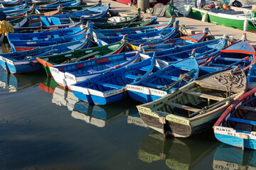 Setubal, Portugal. 11 August 2023. Small traditional colorful fishing boats in the port Setúbal.
