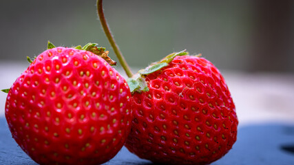 Close up of fresh strawberries showing seeds achenes. Details of fresh ripe red strawberries.