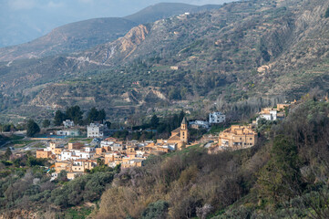 Fototapeta na wymiar Top view of Carataunas, a town in the Alpujarra of Granada, between mountains