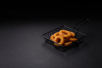 Delicious nutritious squid or onion rings deep fried with salt and spices