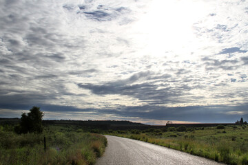 Muddy  dirt road in the Willem Pretorius Nature Resort. Alllemanskraaldam wall in the Sandrivier river, Free State, South Africa. 