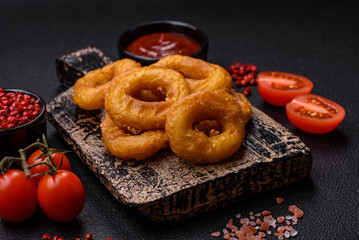 Delicious nutritious squid or onion rings deep fried with salt and spices