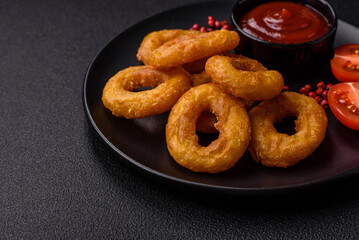 Delicious nutritious squid or onion rings deep fried with salt and spices