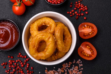 Delicious nutritious squid or onion rings deep fried with salt and spices