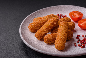 Delicious crispy cheese sticks with mozzarella, salt and spices