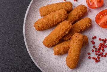 Delicious crispy cheese sticks with mozzarella, salt and spices