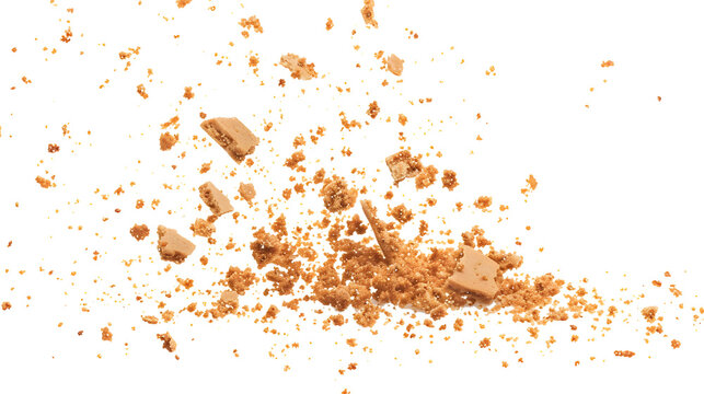 Pile cake crumbs, cookie pieces flying isolated on white, clipping path