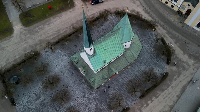 Backwards sideways aerial reveal of Kapellplatz over Gnadenkapelle in Altoetting