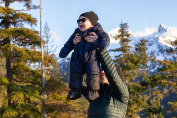 Baby boy and mother happy outside in nature. Squamish, BC, Canada