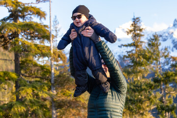 Baby boy and mother happy outside in nature. Squamish, BC, Canada