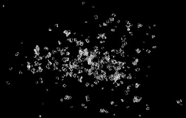 White crystal sugar pile isolated on black background and texture, macro