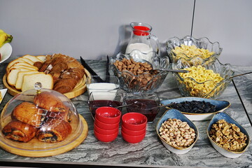 Various types of food for breakfast at the buffet in the hotel