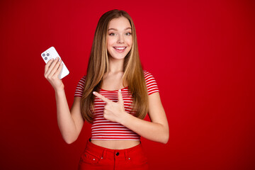 Photo of sweet adorable lady dressed striped top showing finger apple iphone samsung modern device...