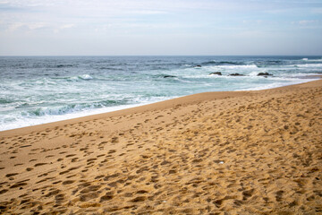 beach in the morning with waves
