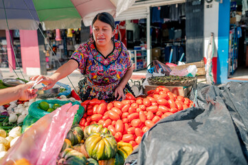 Buying and selling fresh vegetables at a local market in Guatemala.