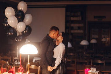 Concept for valentine day or date. Man kissing hand of woman on date