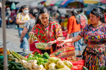 Portrait of two indigenous women in a local market in Guatemala.
