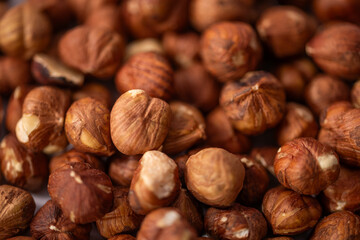 close up of hazelnuts ready for cleaning, hazelnut harvest, nut background raw food nut background, peeled brown nut kernels, healthy organic bio products, vegetarian, vegan and raw food, healthy fat